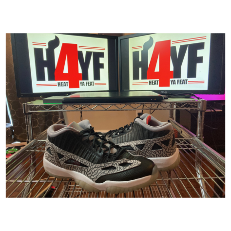 Air Jordan 11 Low IE “Black Cement” — Black/Fire Red-Cement Grey-White (919712-006)